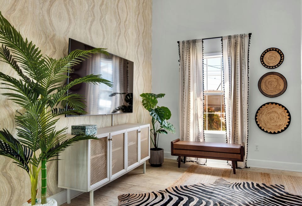 The modern living room features a tv and modern decor.