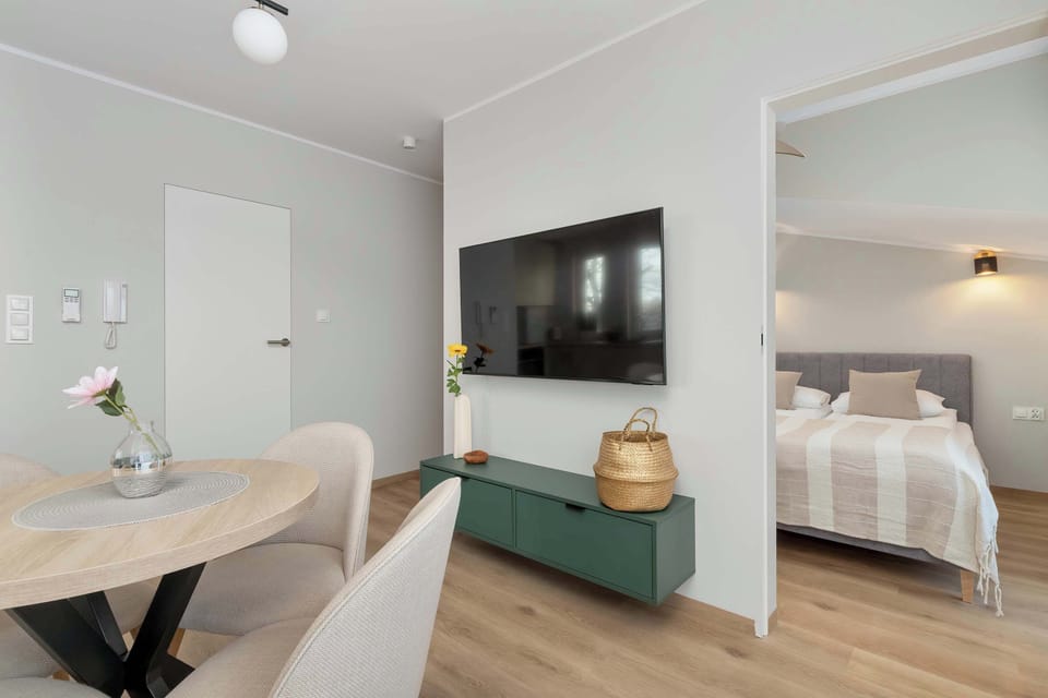 View from the bright living room to the cosy bedroom.