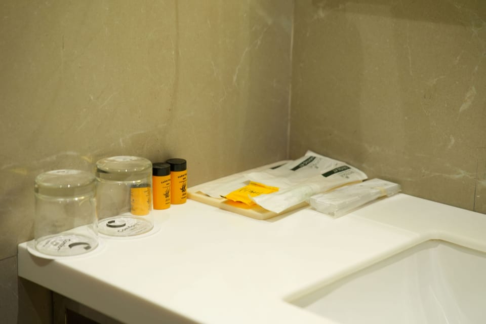 Shower, slippers, towels, soap