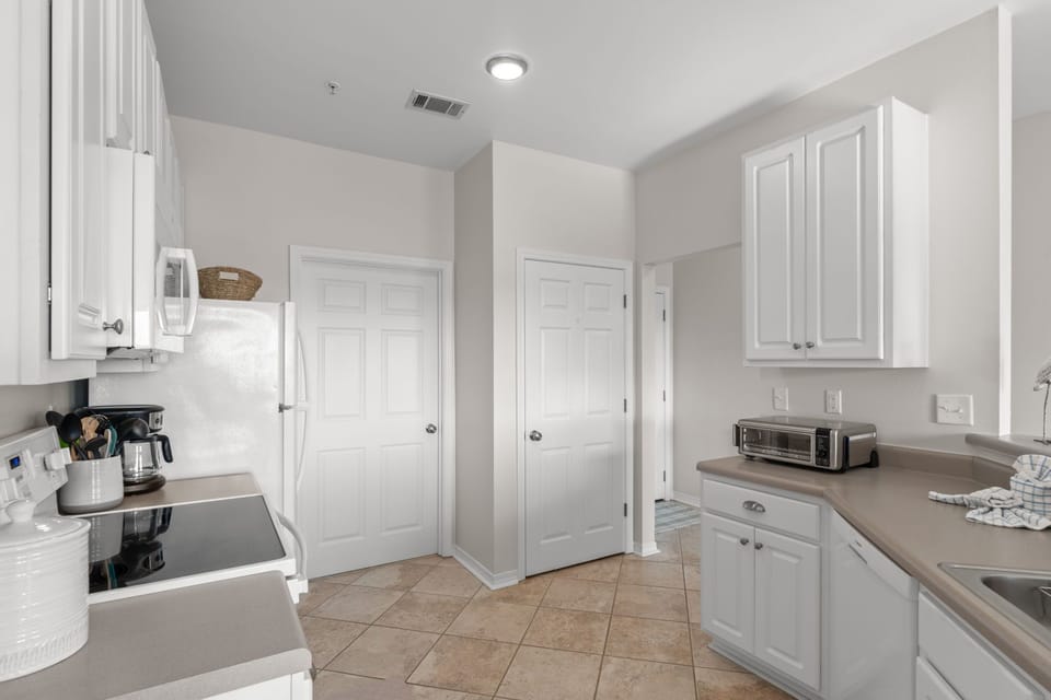 Your fully equipped kitchen features modern appliances and ample counter space for preparing meals during your stay.