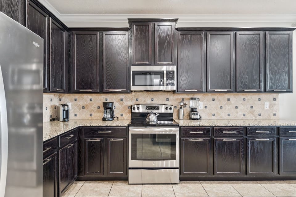 Chef-ready kitchen featuring ample storage and a sleek oven.