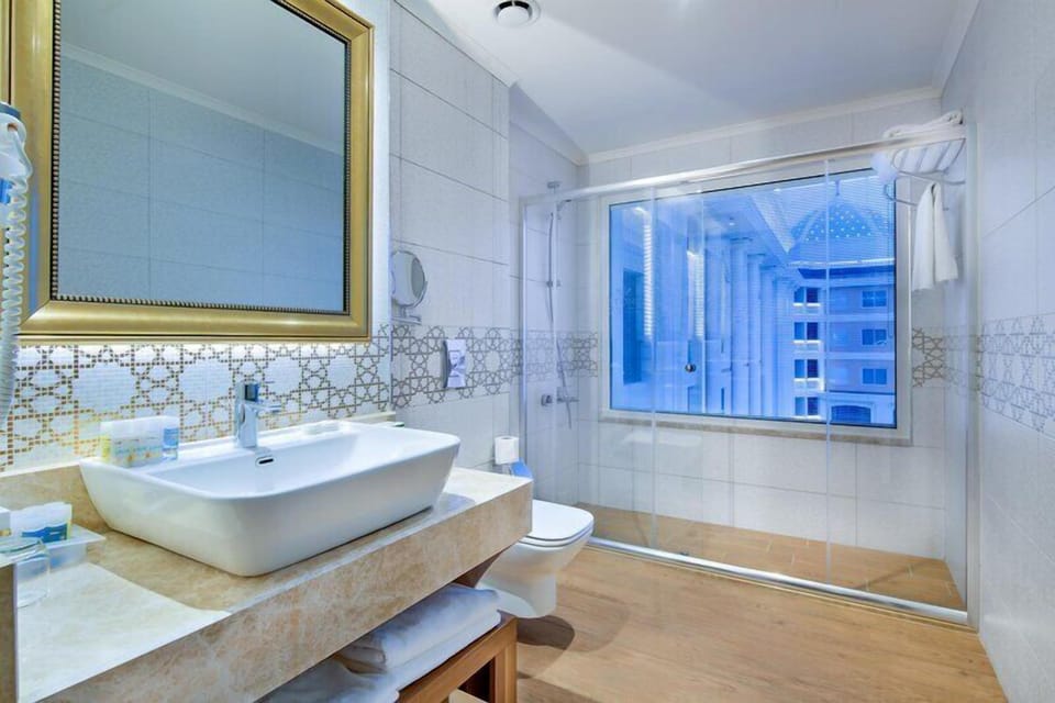 Shower, free toiletries, hair dryer, slippers