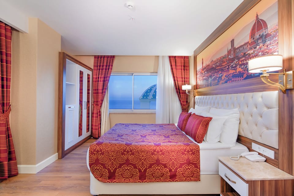 Family Room | Free minibar, in-room safe, desk, laptop workspace