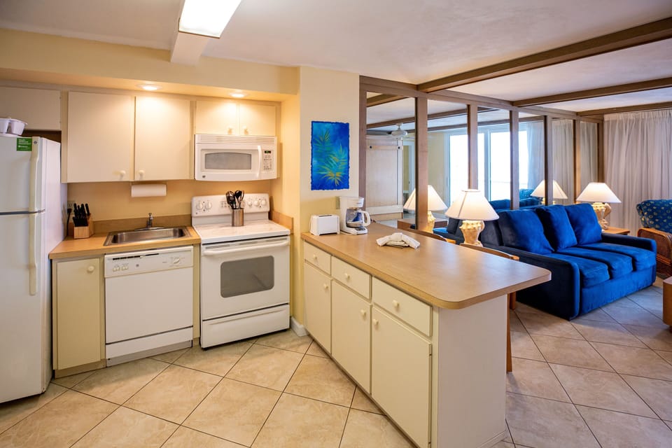 The full kitchen is equipped with modern appliances, offering convenience for meal preparation during your stay.