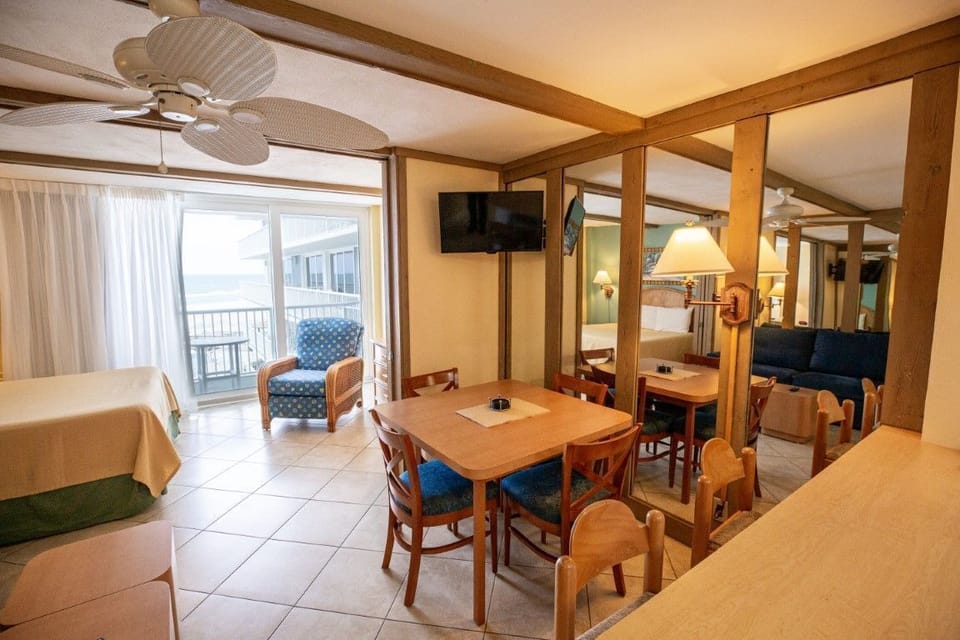 Bright and airy, the dining area and living space seamlessly connect to showcase the oceanfront lifestyle.