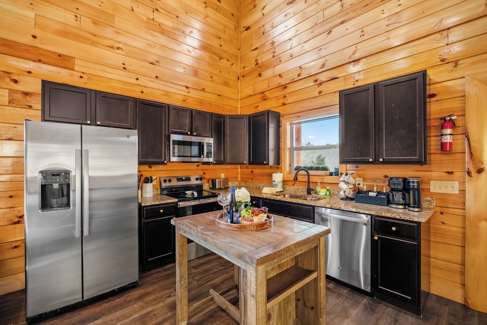 Sunny cabin kitchen-granite, island,stainless and mountain views