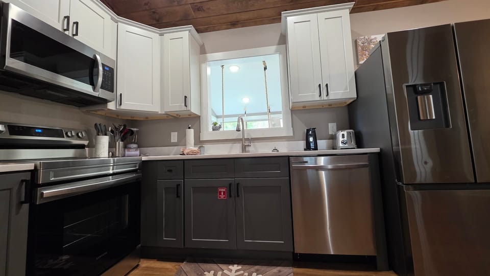 Sleek appliances and mountain views make cooking a delight in this modern culinary space!