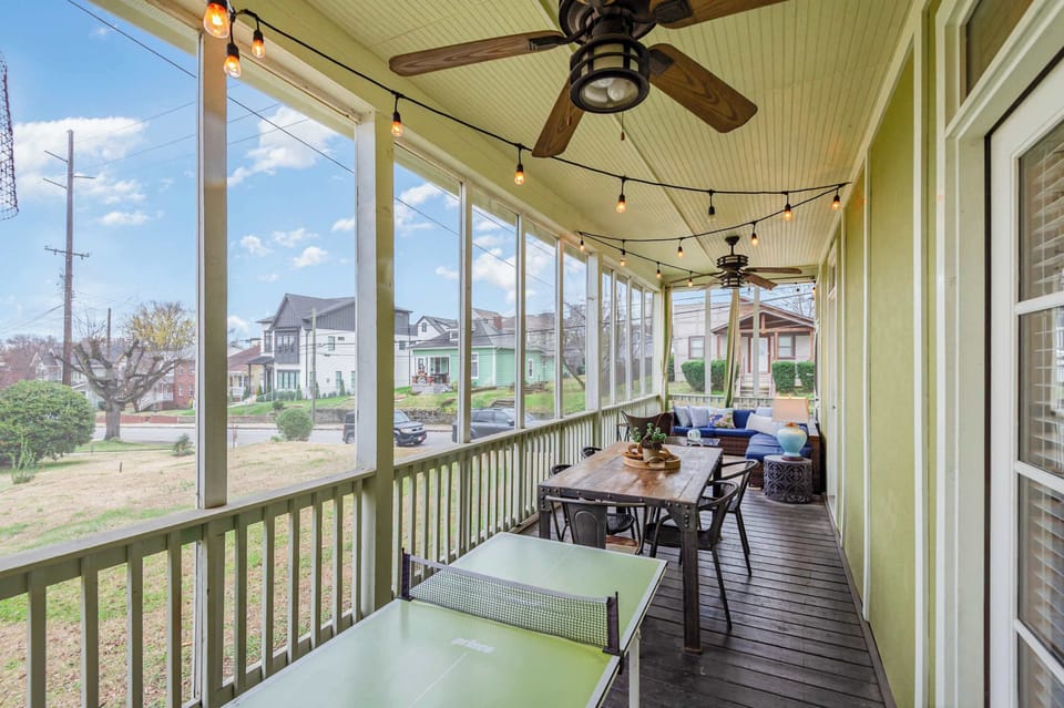 Huge screened porch with ping pong, lounge seating, and dining area! Perfect hangout spot.