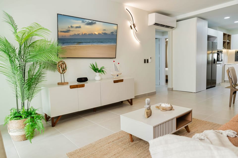 Stylish Living Room with Smart TV and Open Modern Kitchen