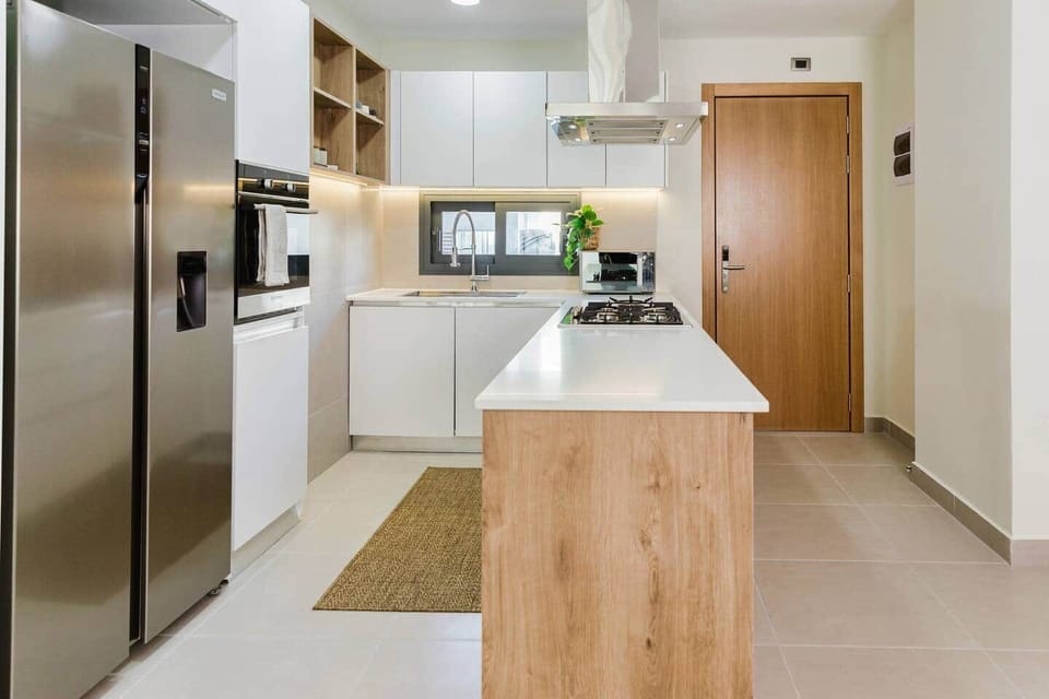 Bright Contemporary Kitchen with Island, Gas Stove and Modern Appliances