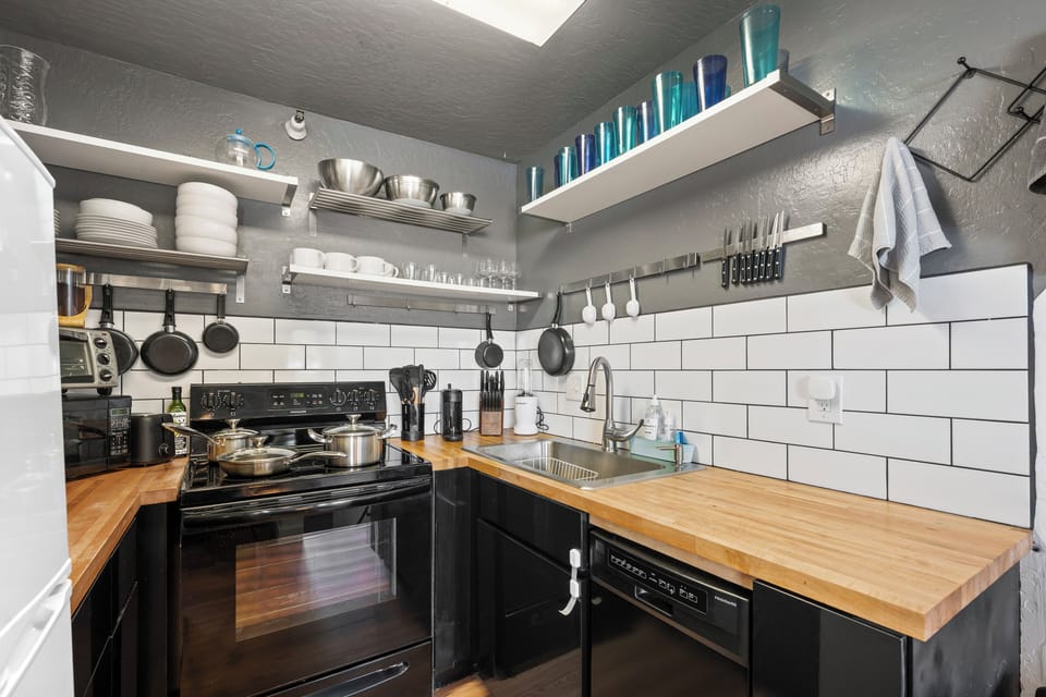 Our galley kitchen is fully equipped with all the amenities our guests could need. 