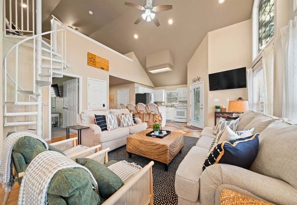 Soft textures and warm tones give this living room a cozy charm that makes it easy to settle right in.