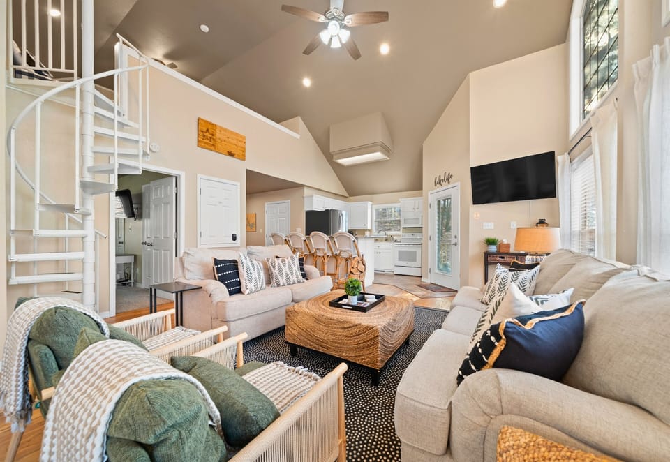 Soft textures and warm tones give this living room a cozy charm that makes it easy to settle right in.