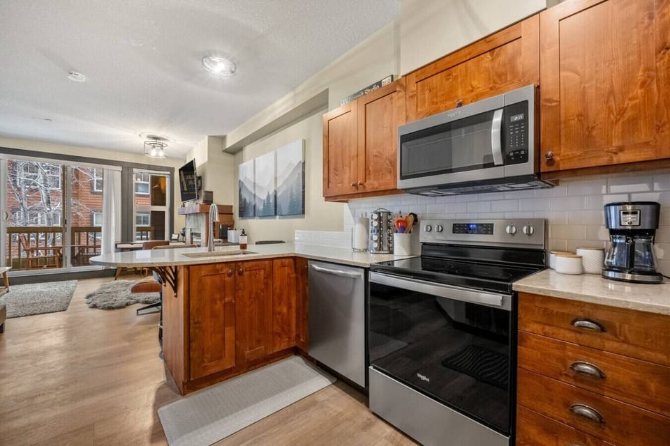 Full kitchen with a drip coffee maker, ground coffee, tea, sugar, and basic condiments (ketchup, mustard & relish.)