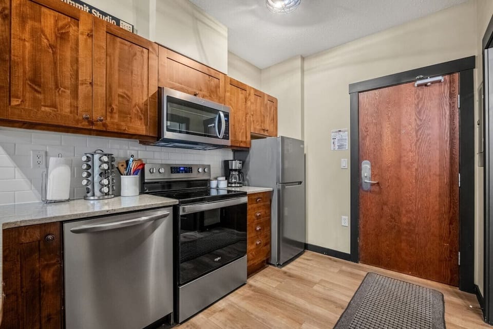 Full kitchen with a drip coffee maker, ground coffee, tea, sugar, and basic condiments (ketchup, mustard & relish.)