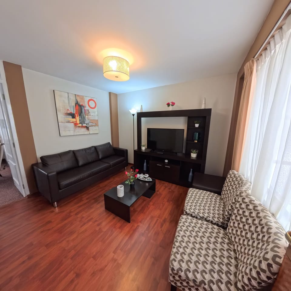 Standard Suite, City View | Living area | 42-inch LED TV with cable channels
