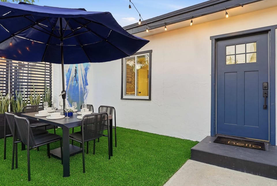 Enjoy alfresco dining in this stylish, shaded outdoor space designed for effortless gatherings.