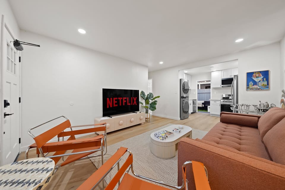 Modern living area with comfortable seating and smart TV.