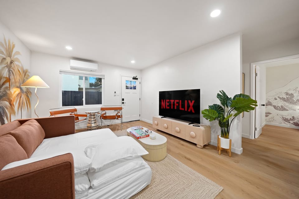 Settle into this beautifully designed living space, highlighted by plush seating and soothing natural tones.