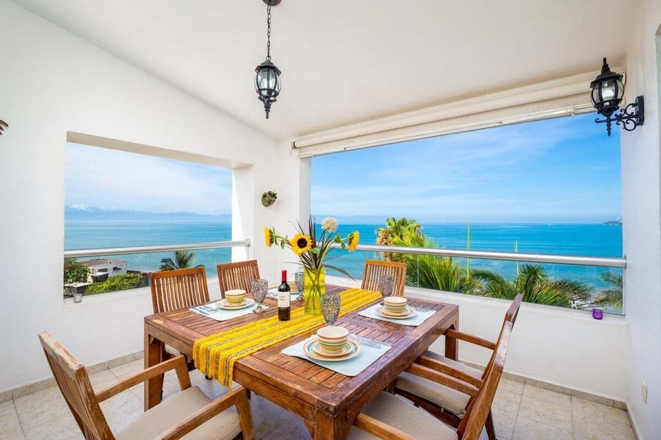 Balcony Terrace with Table and chairs that can be used at any time. where you can enjoy the beautiful  view of the ocean while you eat.