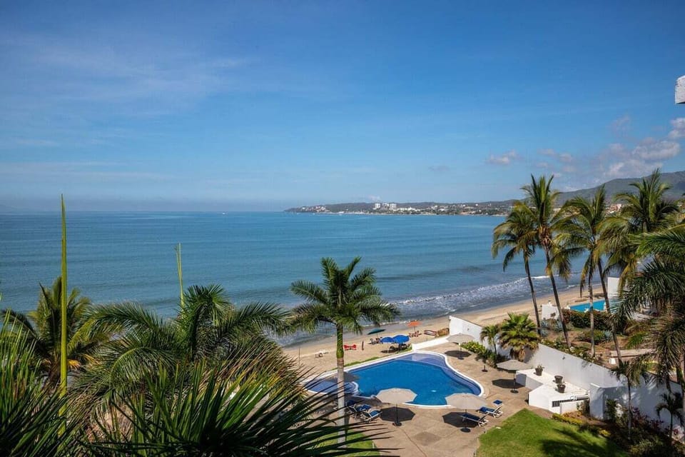 Wake up to sweeping views of Banderas Bay and the sparkling Pacific Ocean from this elevated beachfront retreat.