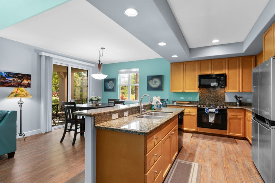 Beautiful kitchen has abundant counter and cabinet space and everything you need to prepare
an amazing meal for a night in with your ohana.