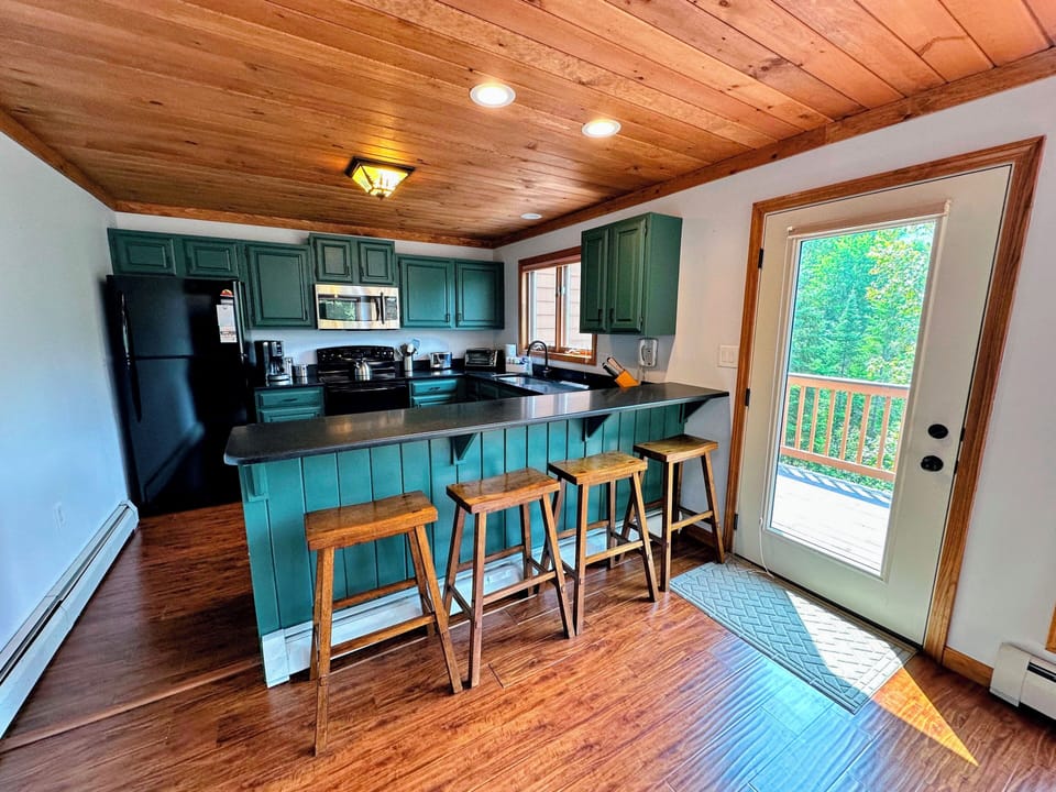 Kitchen area with breakfast bar