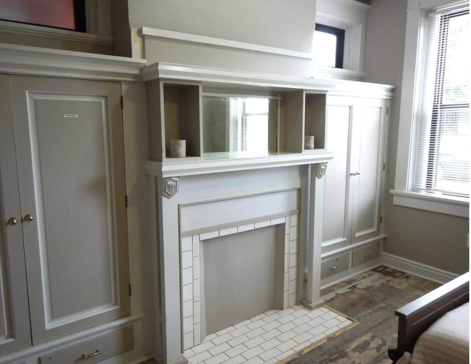 This is the built in cabinet.  Note the bed on the left.  Since the house was built in 1900 each room downstairs had it's own fireplace for heat.