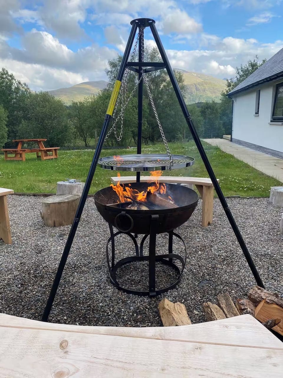 Fire pit area with bench seating for 8. For BBQs and outdoor log fires. 