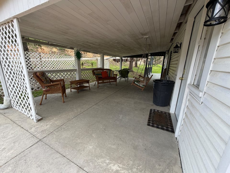 Covered outdoor space for morning coffee, relaxing, or planning the day's Hocking Hills adventures