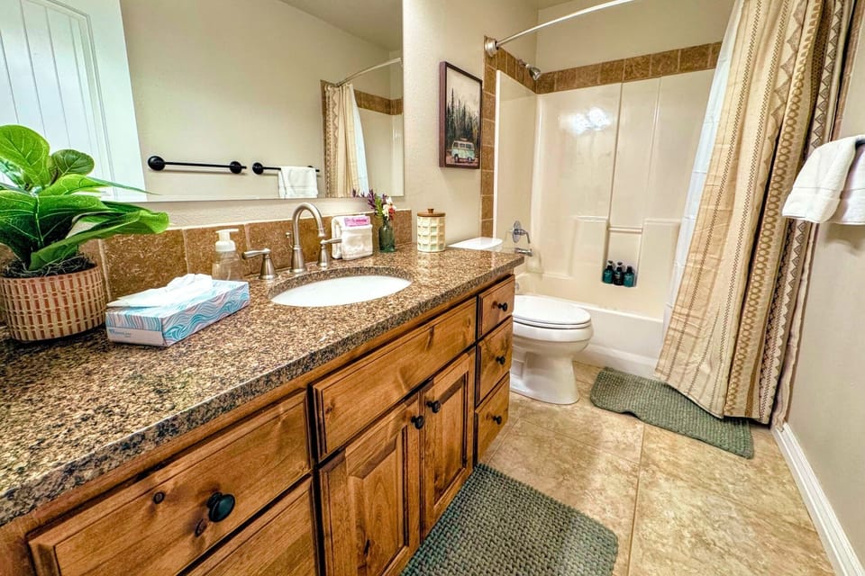 The main floor living area, as well as Bedrooms #2 and #3, share this full bathroom.