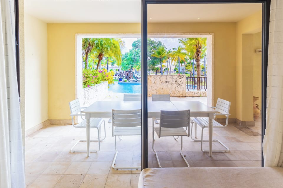 Outdoor dining area on the private terrace overlooking tropical surroundings