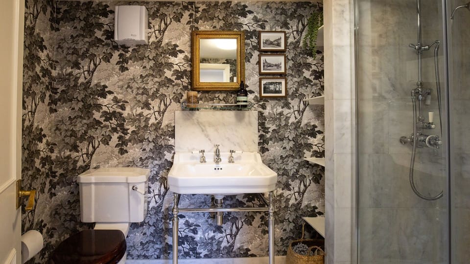 The shower room features a magnificent rainfall shower, Bell Cottage.