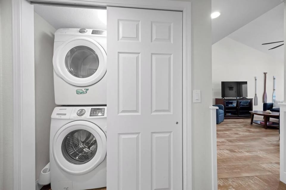 Convenient laundry area w/ stacked washer & dryer for easy stays.