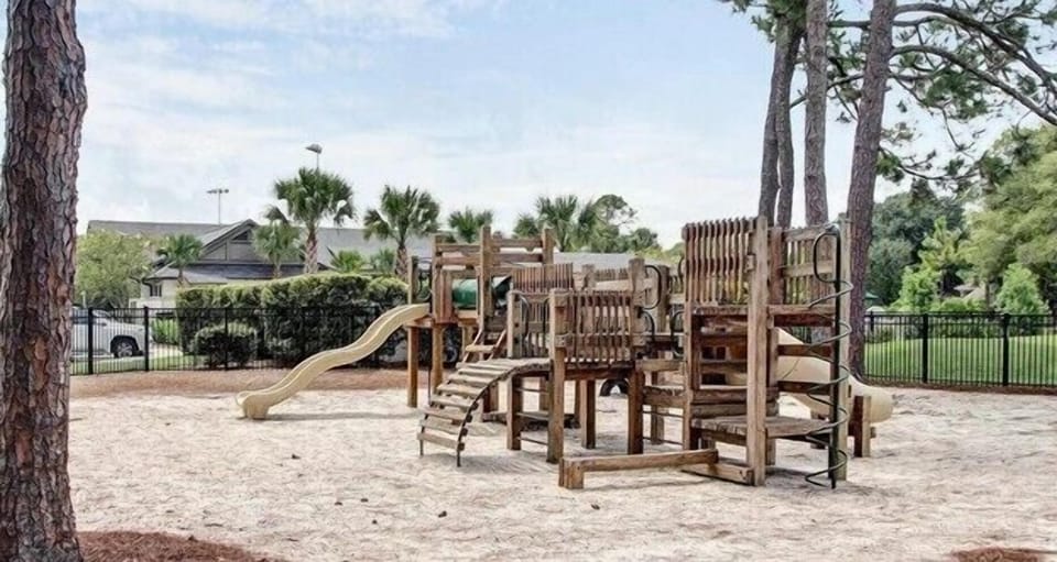 Community Play Park - Outdoor play area w/ seating and space to relax or gather.