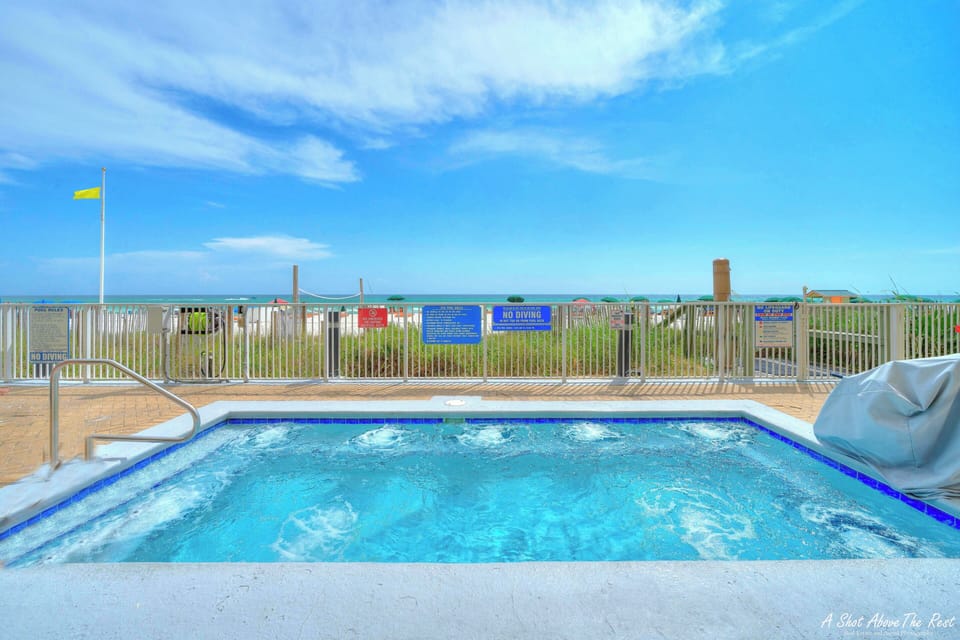 Relax in the hot tub after a long day at the beach.