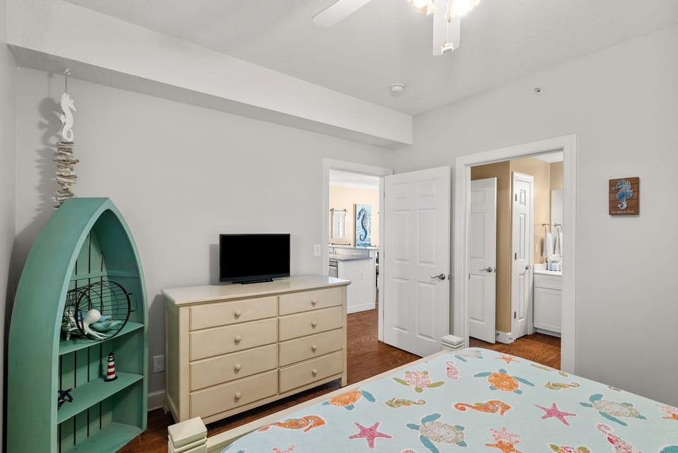 The second bedroom offers a queen-sized bed and its own television.