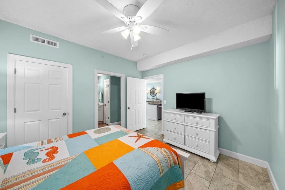 The second bedroom offers a queen-sized bed and its own television.