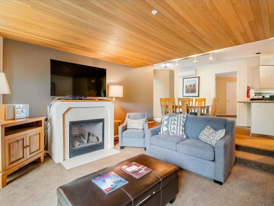 Kick back in the living room with plenty of space, beautiful views, and the perfect spot to enjoy wine, your favorite show, and the fireplace glow.