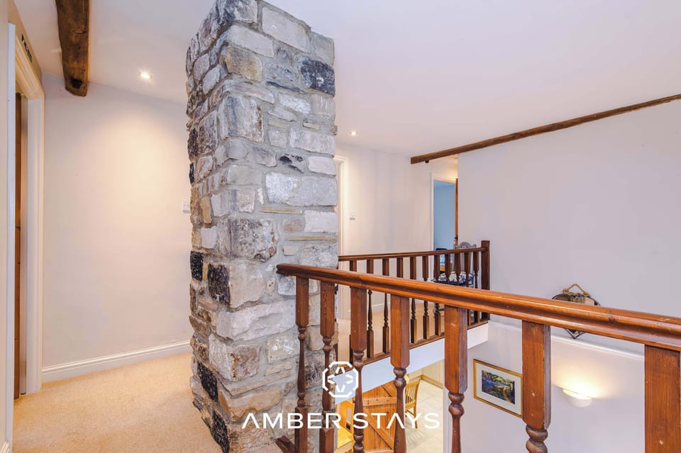 A bright and welcoming living room with comfortable seating, soft lighting, and a warm, inviting atmosphere perfect for relaxing or entertaining guests.