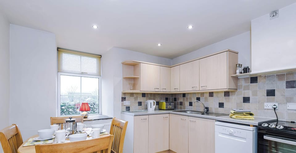 A fully equipped kitchen with modern appliances, ample counter space, and smart storage deal for cooking, entertaining, and enjoying meals.