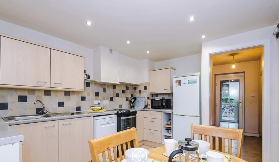 A fully equipped kitchen with modern appliances, ample counter space, and smart storage deal for cooking, entertaining, and enjoying meals.