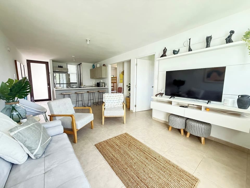 Living room with flat screen tv where you can stream your favorite apps