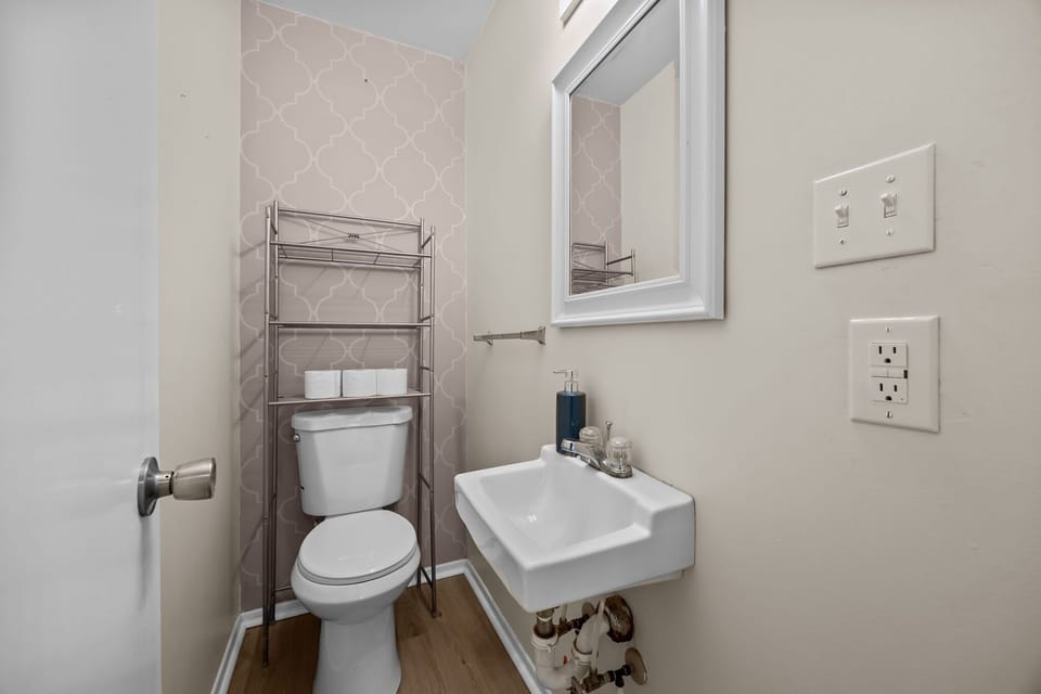 Main Level: Half Bathroom Adjacent to Queen Bedroom 1