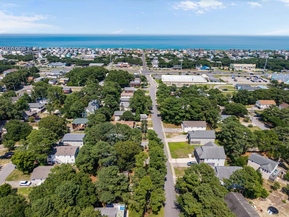 Aerial View of Property with Nearby Beach Access