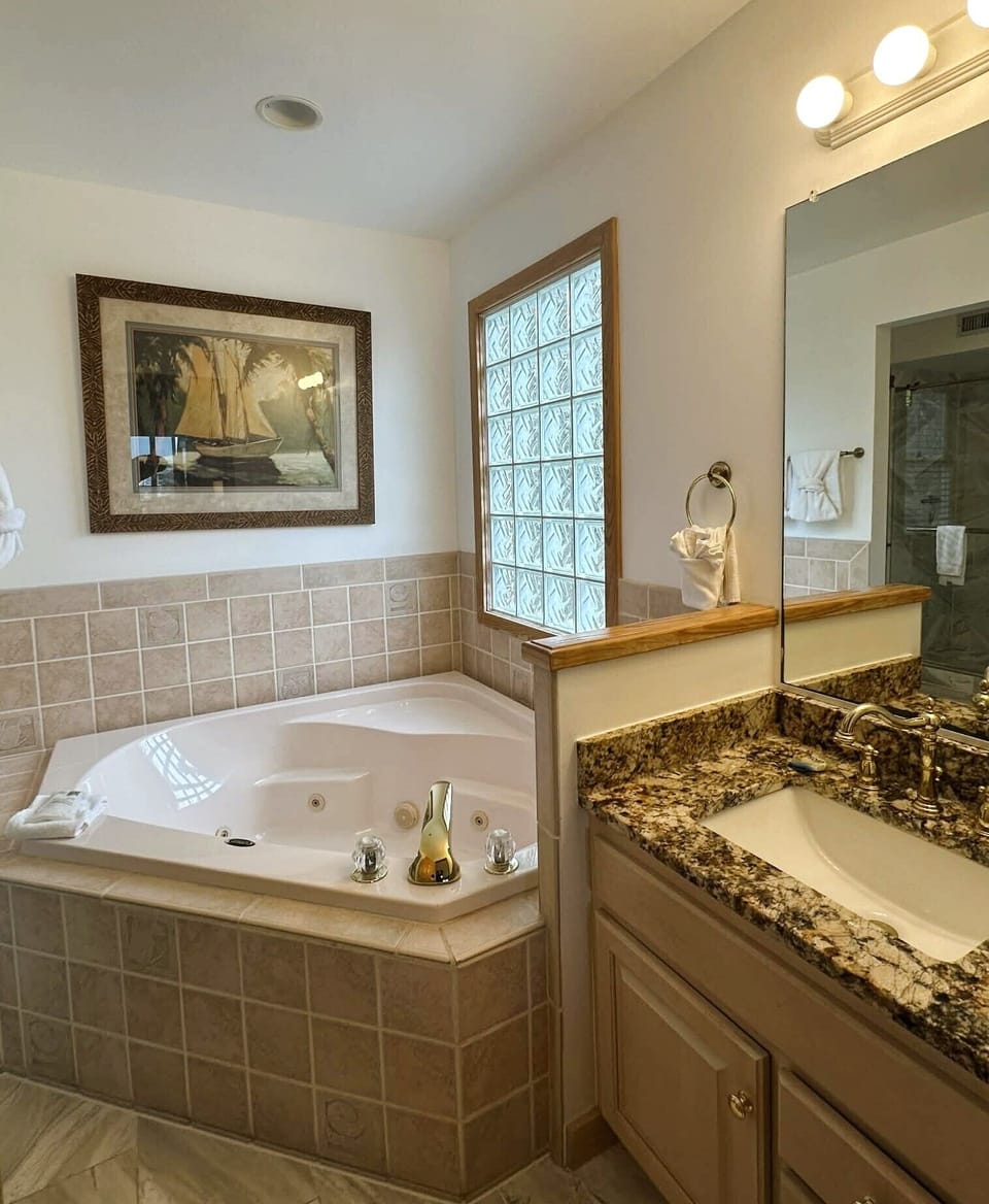 Bathroom with tub and shower room