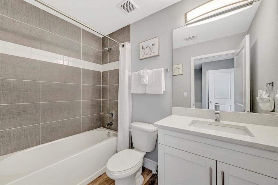 Step into your freshly updated bathroom—modern fixtures, neutral tones, and a soothing palette create the perfect space to unwind after a day of exploring.