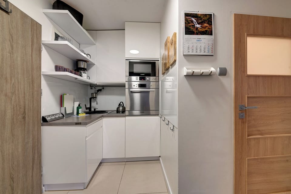 Apartment, Balcony | Private kitchen | Coffee/tea maker, electric kettle