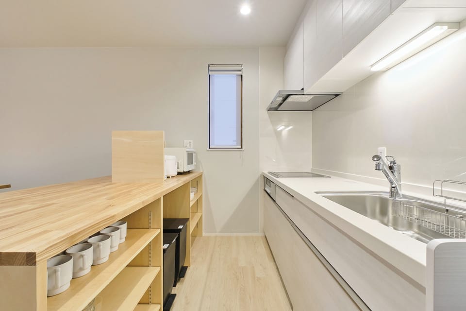 Comfort Condo, Non Smoking | Private kitchen | Electric kettle, cleaning supplies, dining tables