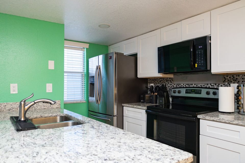 Fully Equipped Kitchen with Granite Counters and Stainless Appliances. Cook meals easily or enjoy takeout nights in.